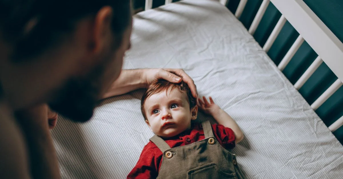 Baby bangs head 2024 on crib while sleeping